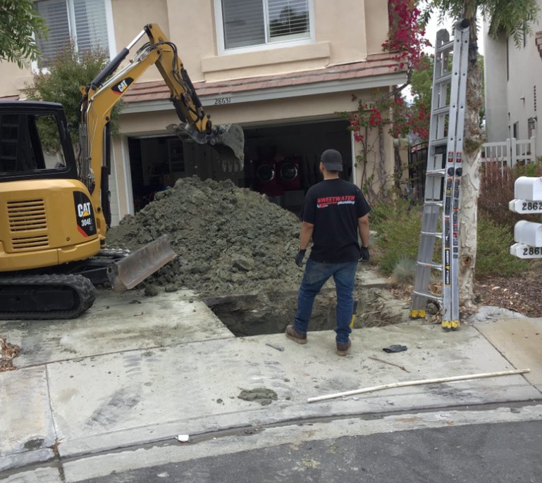Trench being dug for underground gas line installation.
