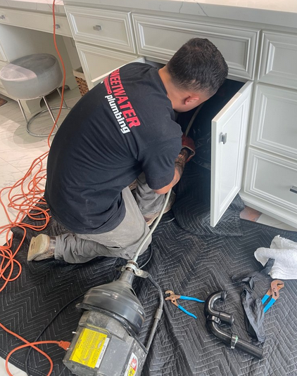 burst pipe under a sink.
