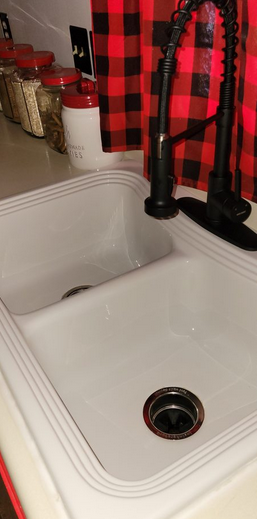 A kitchen sink after drain cleaning.