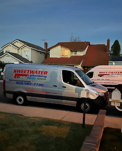 Sweetwater Plumbing service van parked in a residential neighborhood, ready for plumbing repairs.