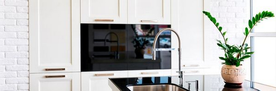 A modern kitchen with upgraded plumbing.