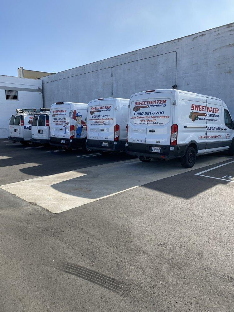 Sweetwater Plumbing service vans parked.