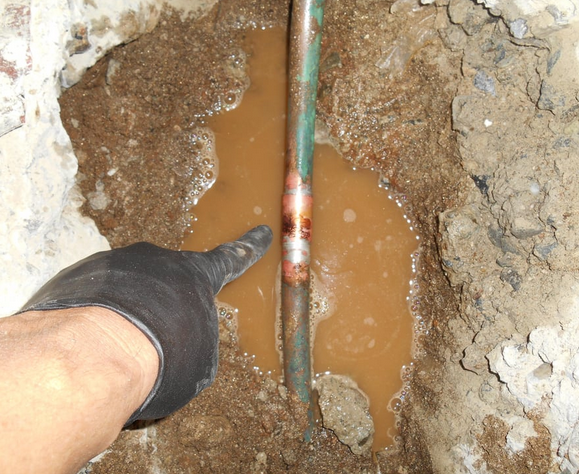 a plumber pinpointing sewer line leak.