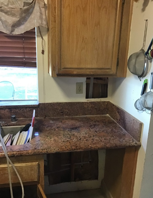 Repiping gas line in a kitchen.