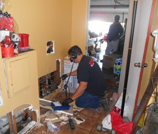 A plumber fixing a gas leak after hearing hissing sound.