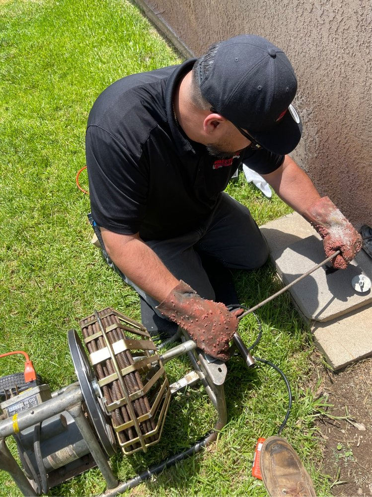 A man doing drain cleaning in Riverside