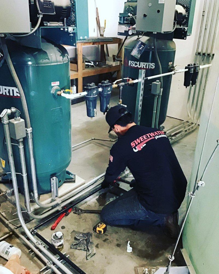 A plumber fixing pipeline.