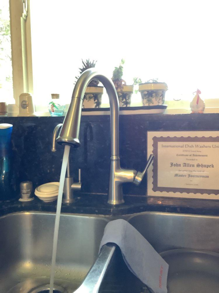 A running kitchen faucet.