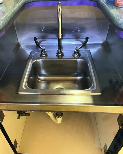 Repair bar sink faucet to prevent clogged drain.