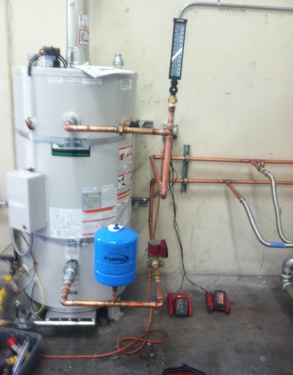 A tank water heater installed in a home.