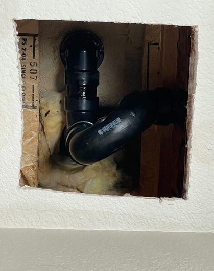 A leaky pipe in a house.