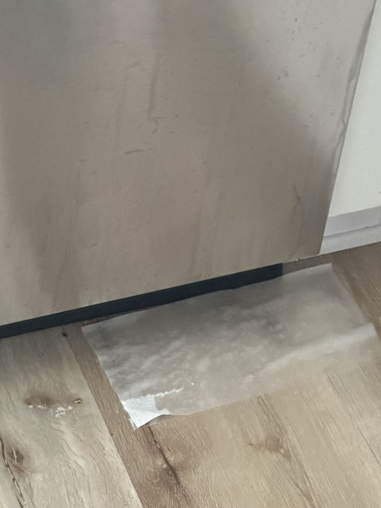 Dishwasher water backup causing kitchen floor leak