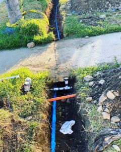 Gas pipes and fittings being checked for building code compliance