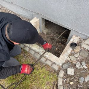 Plumber performing gas line repair with professional equipment