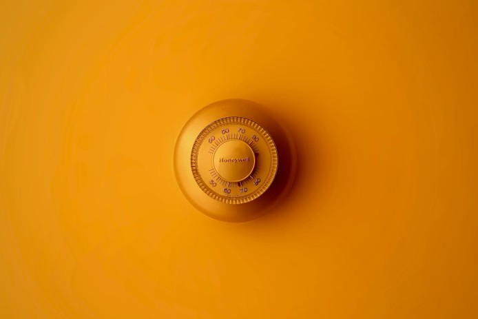 A secure yellow padlock on a yellow background